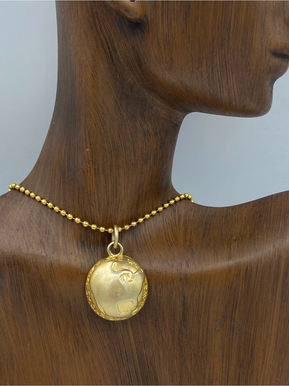 Gold Tone Globe Pendant Necklace She Who Travels Far Knows Much
